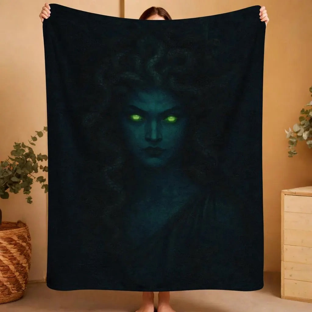 Medusa plush blanket featuring the serpent-haired Gorgon with glowing green eyes on a dark fleece throw